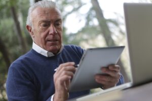 Elderly man using a tablet
